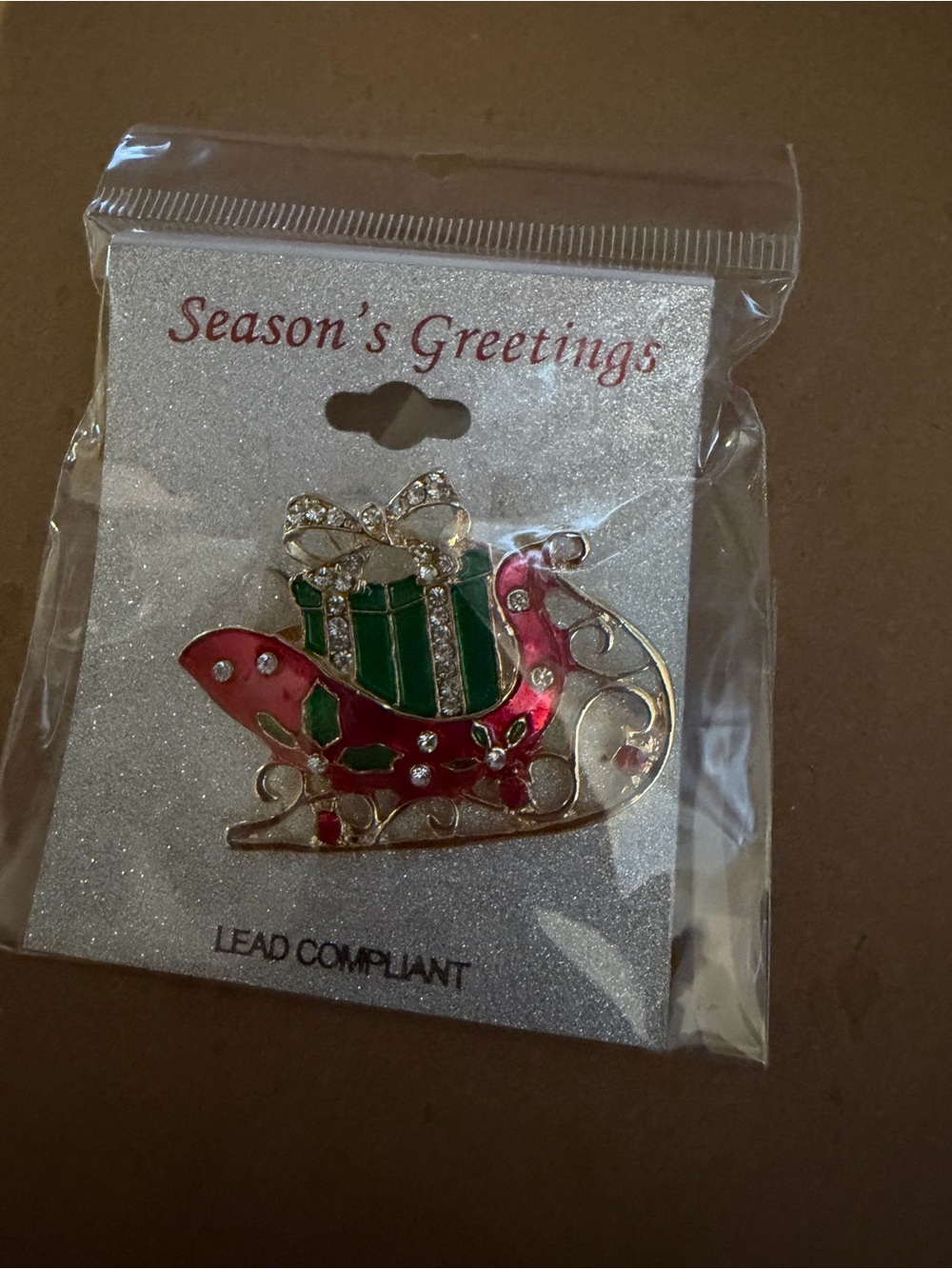 Gold-Tone Red and Green Sleigh Brooch with Rhinestone Gift Accent